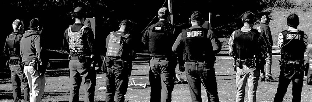 A group of Sharp County Sheriff Deputies training - in black and white. 
