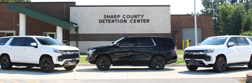 Three unmarked Sharp County Sheriff patrol vehicles in front of the Sharp County Detention Center.
